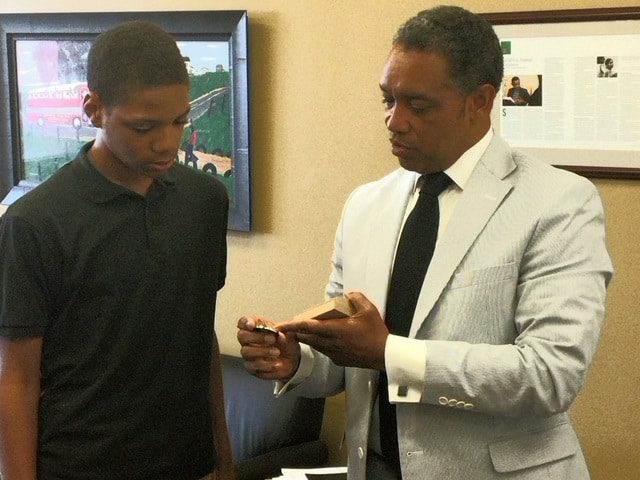 Warren King receives an award from D.C. Attorney General Karl Racine