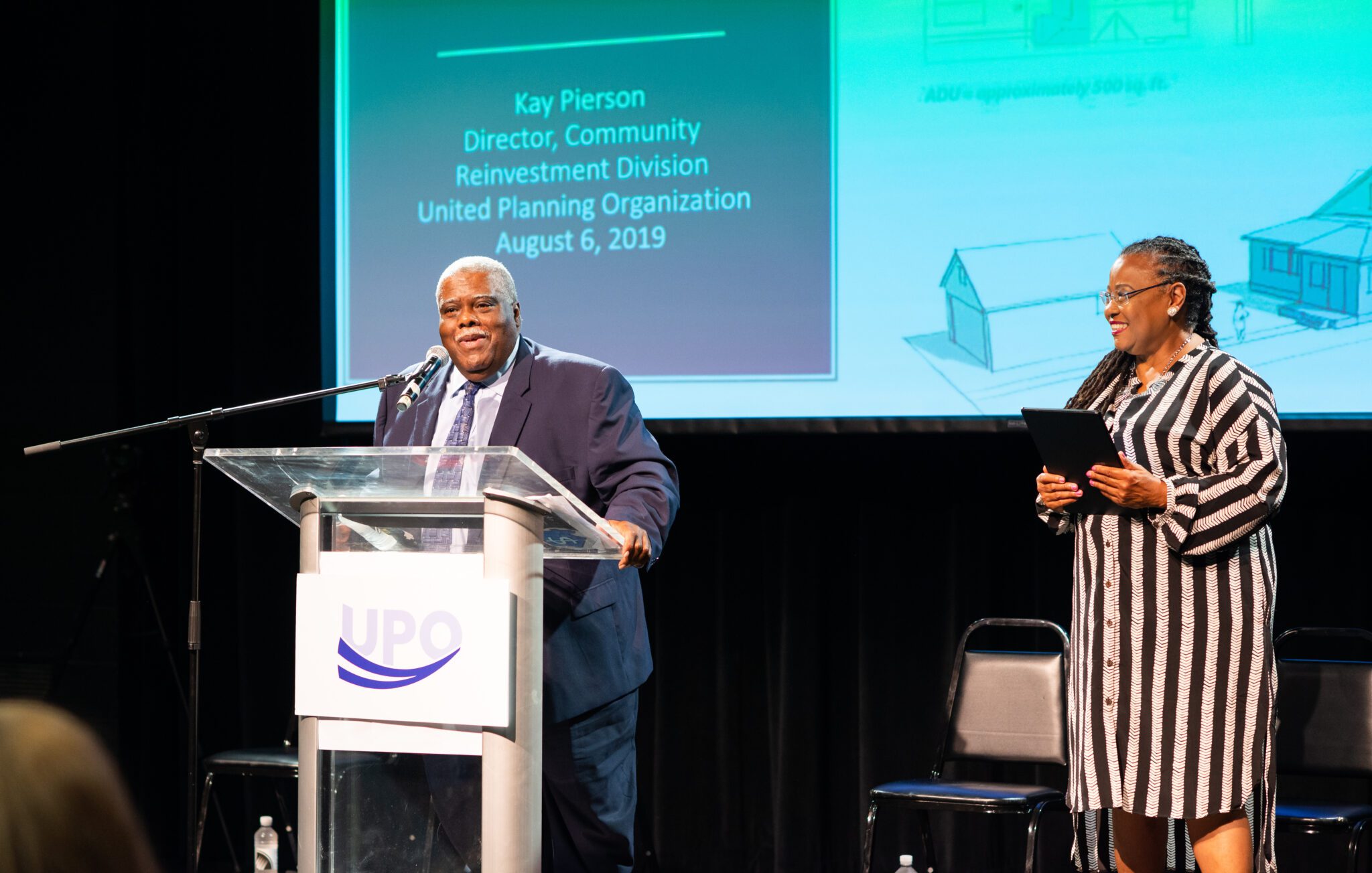 speaker at a conference podium