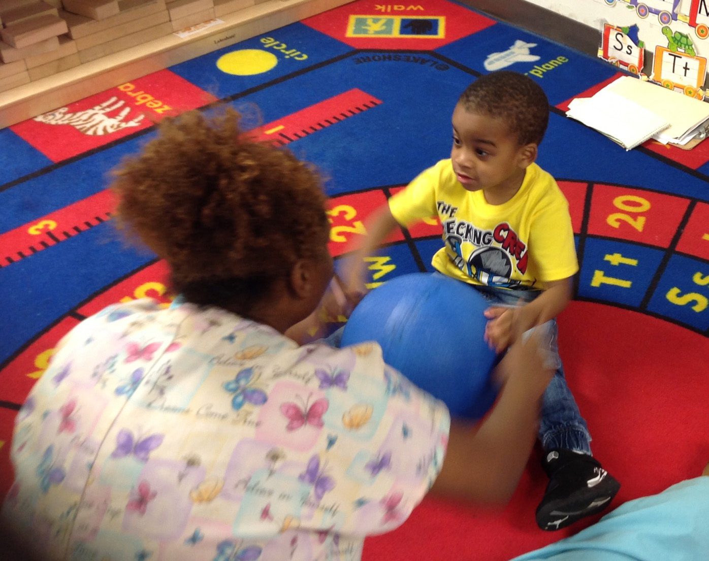 Woman playing with a preschool child