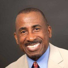 black-american man in business attire smiling