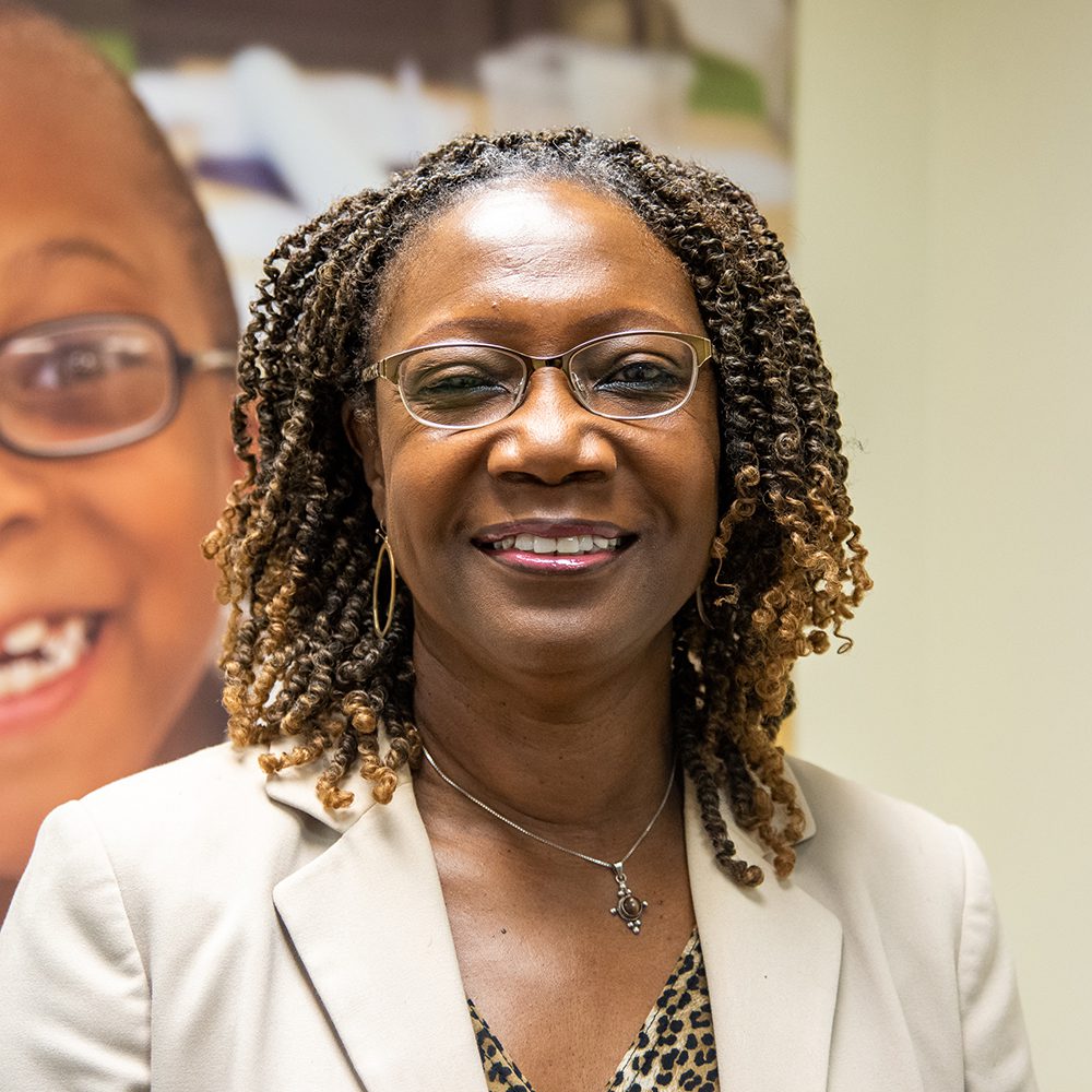 black-american woman in business attire smiling