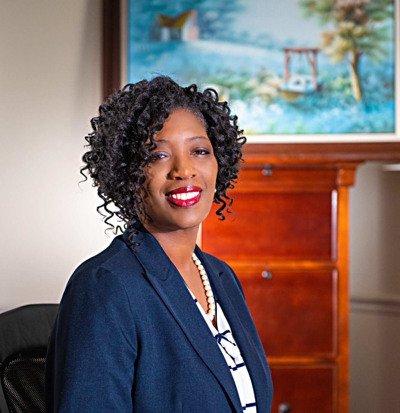 african-american woman in business attire smiling