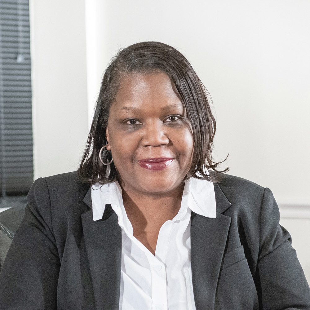 black-american woman in business attire smiling