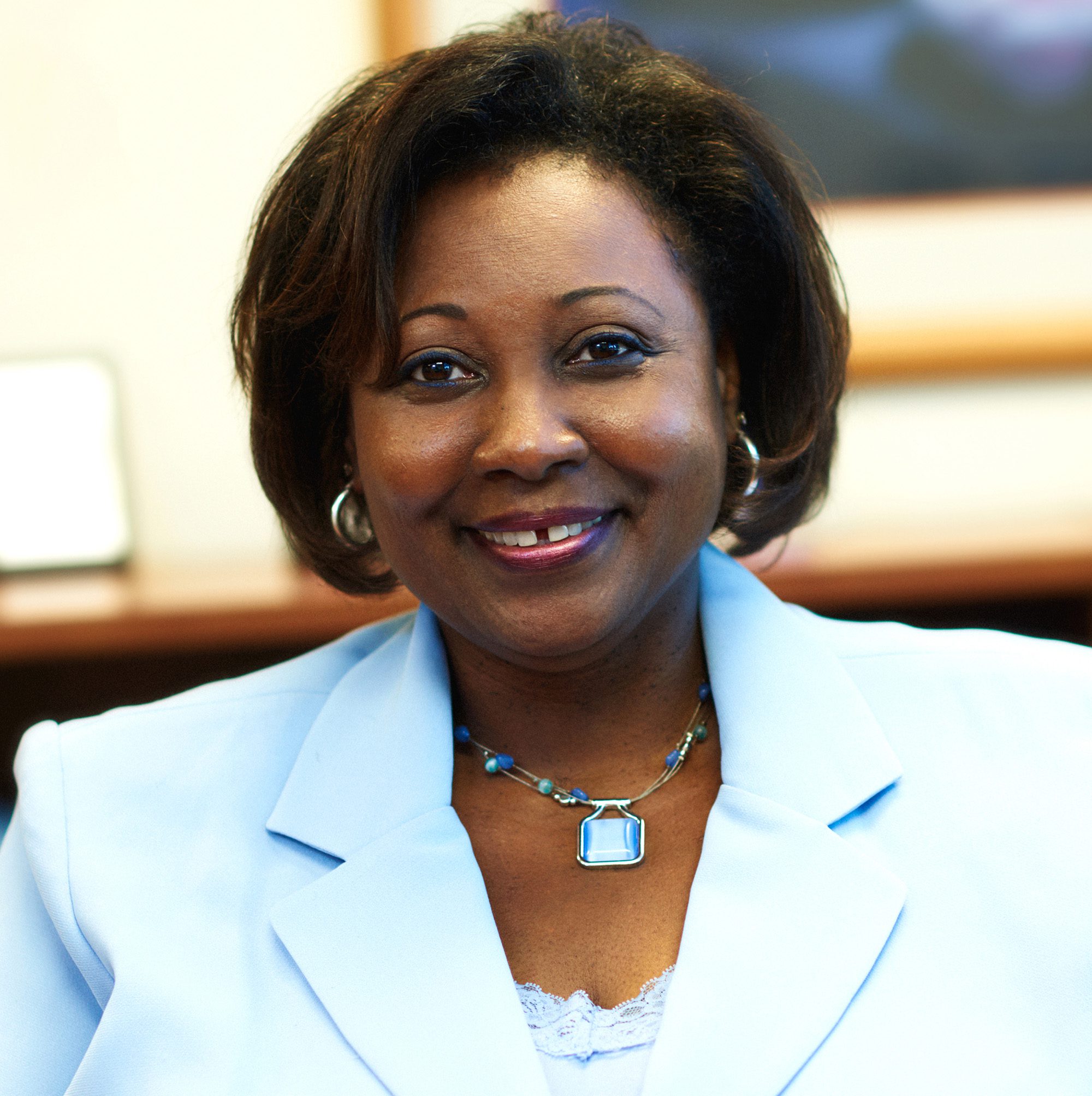 black-american woman in business attire smiling