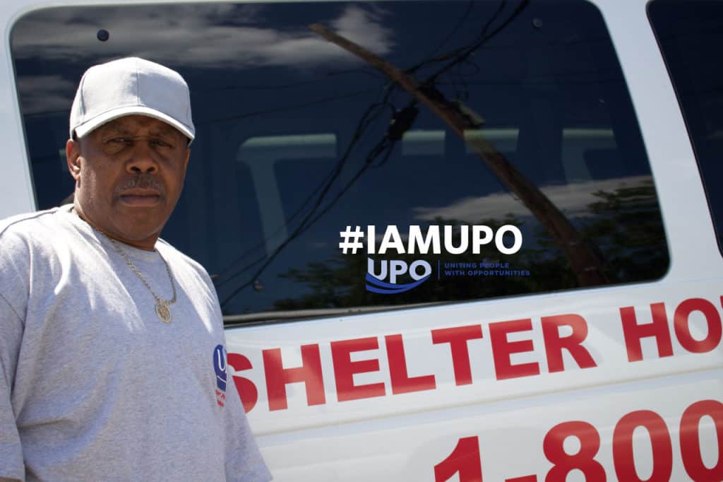 Vincent next to shelter hotline van and text "hashtag I am u p o"