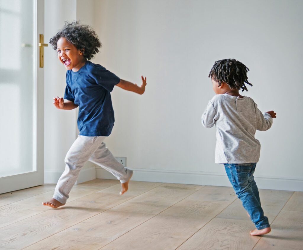 Young black boys playing in their new house