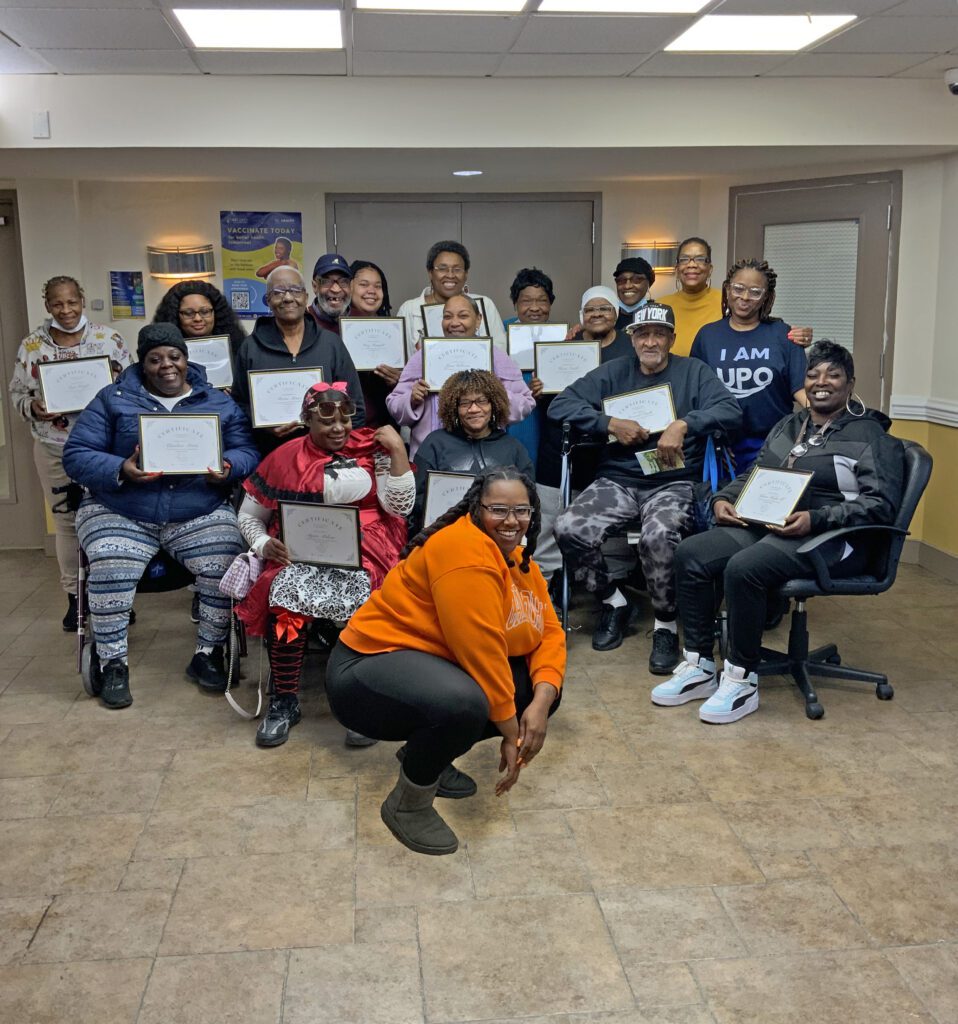 Group of UPO community members holding up certificates