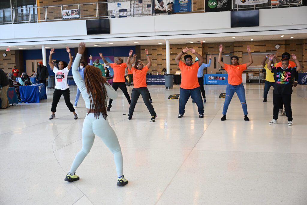 People being led in dance exercises at the health and wellness expo