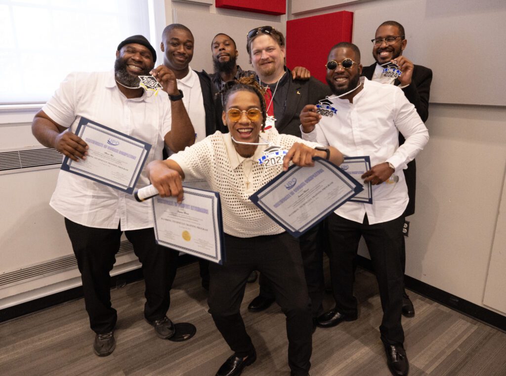 group of men with diplomas