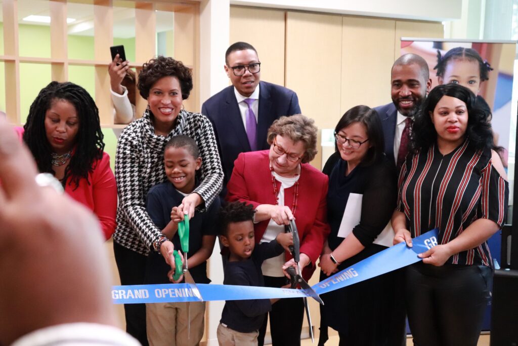 UPO members and children cutting a ribbon together