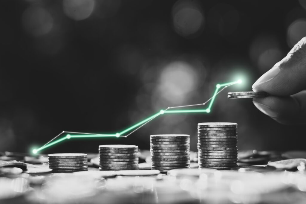 Stacks of coins. They get incrementally taller and a graph line is shown about them