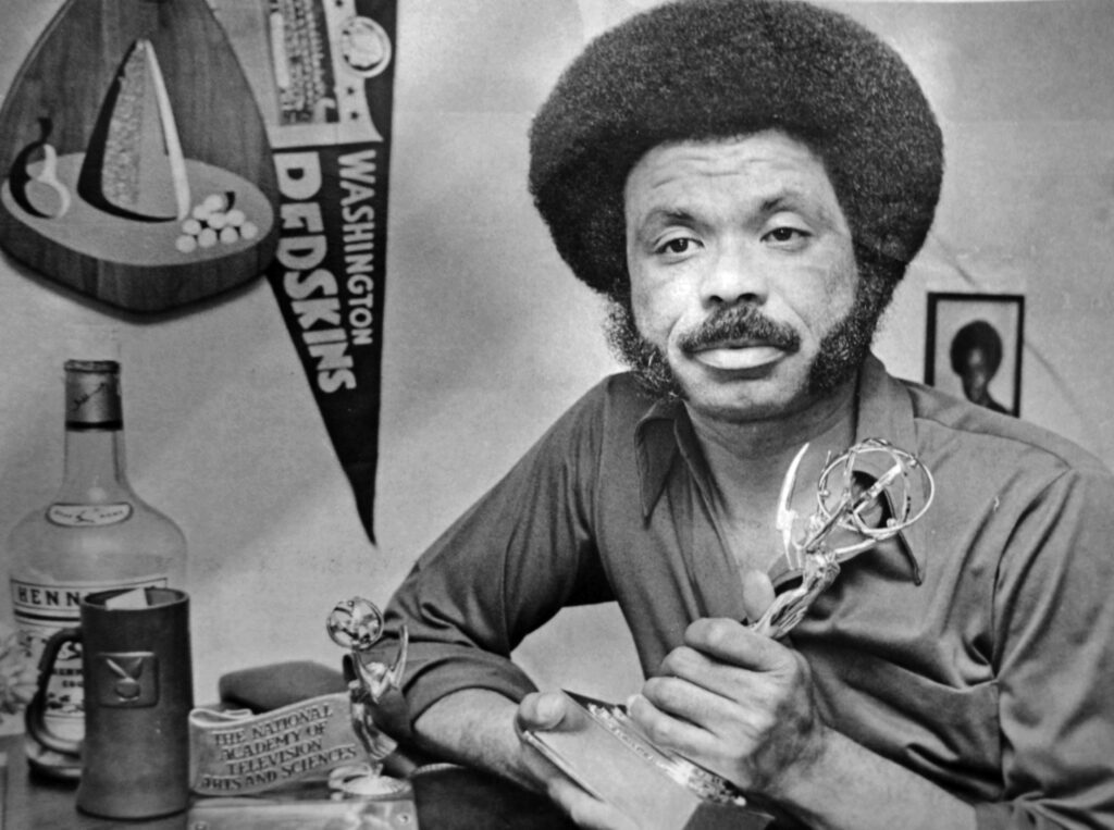 Petey Greene holding an award