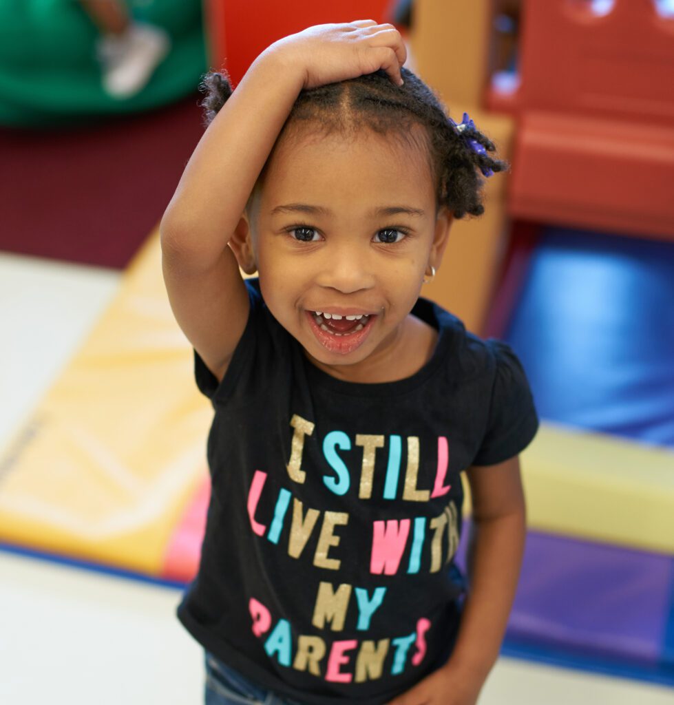 Young girl with her hand over her head