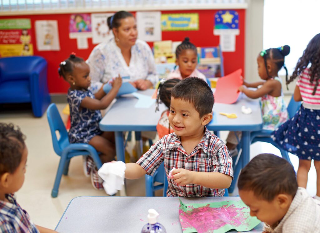 Children painting in a classroom